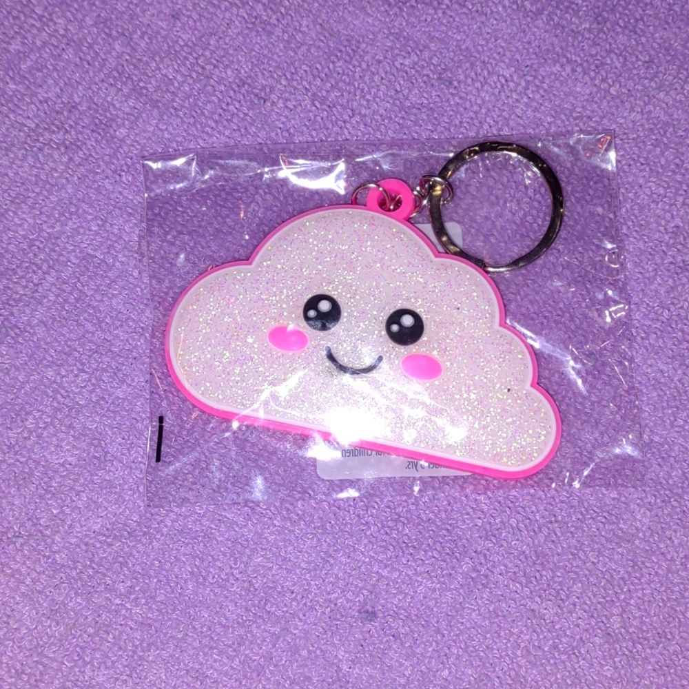 A little cloud keychain with a cute little face